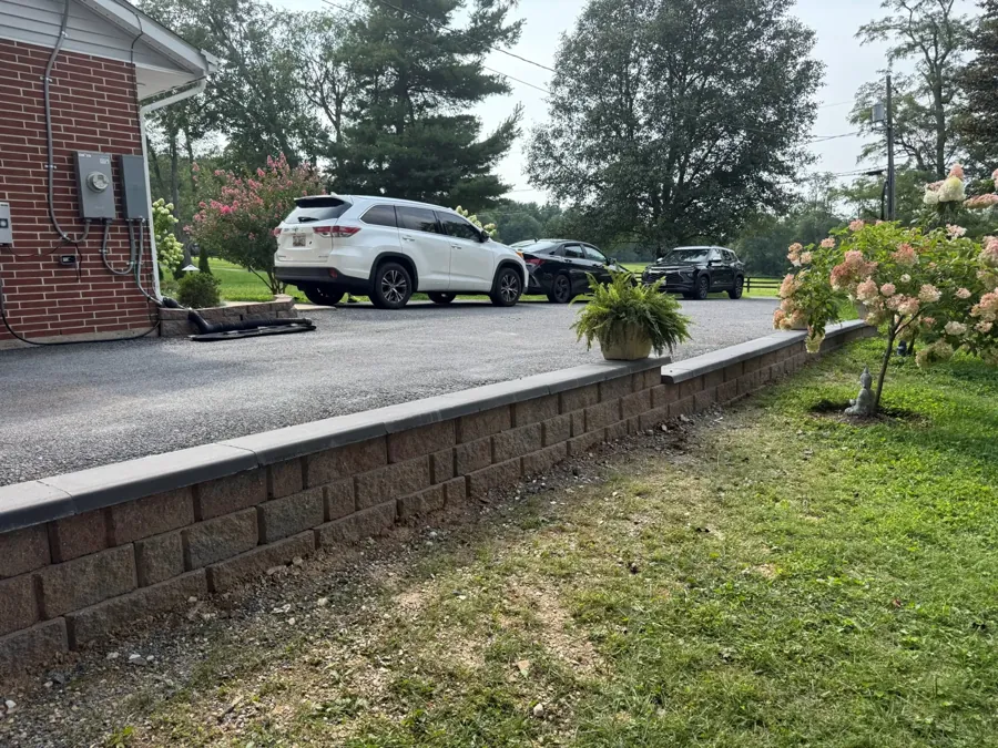 Block retaining wall along the drive